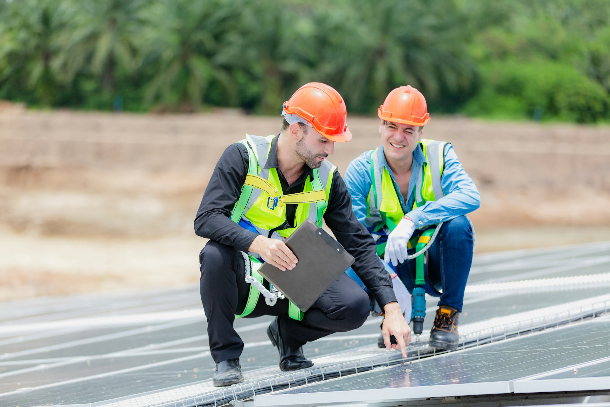 Technician engineer planning to setting solar panel on roof of building to work at full efficiency